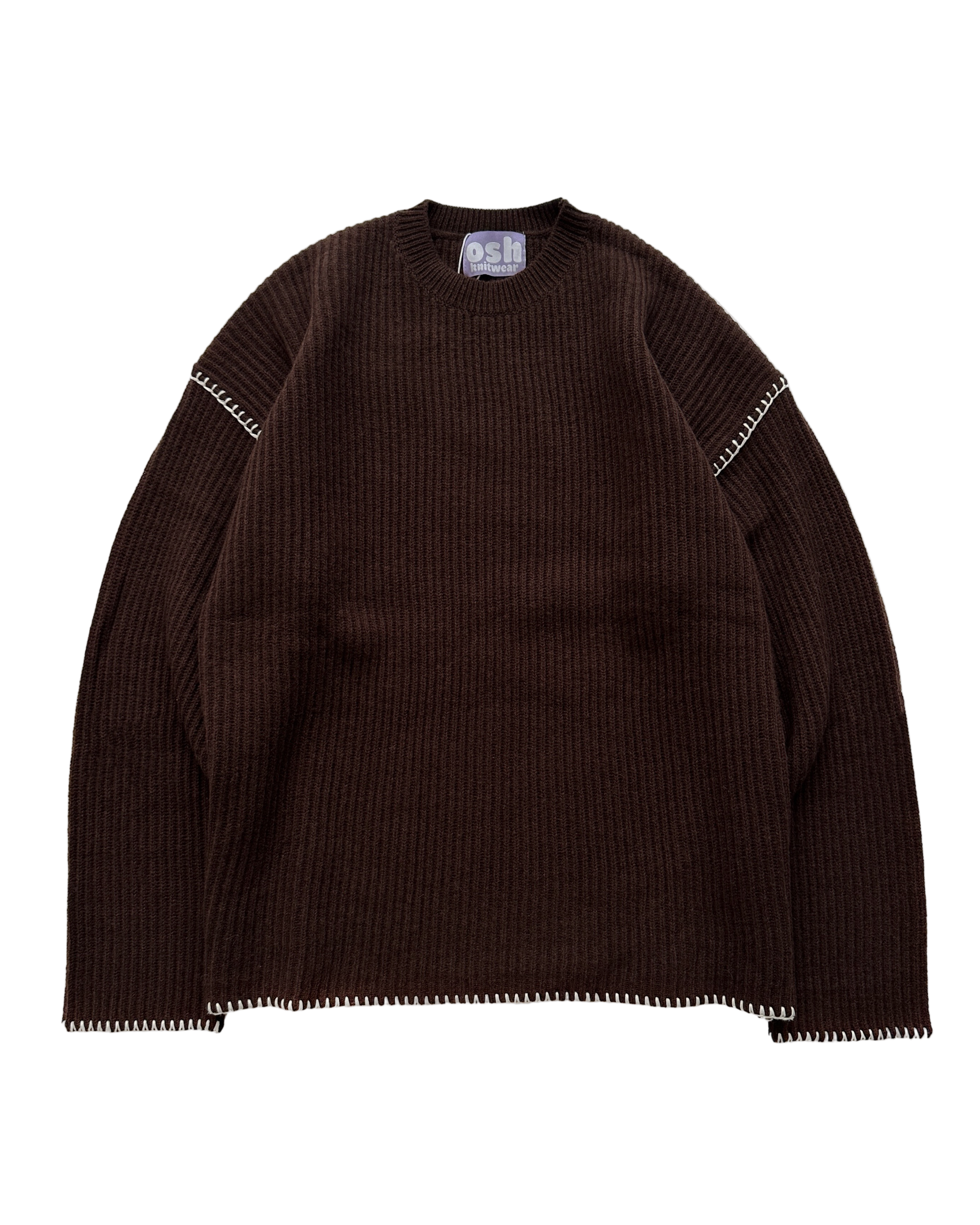 Brown ribbed sweater with white trim on a white background